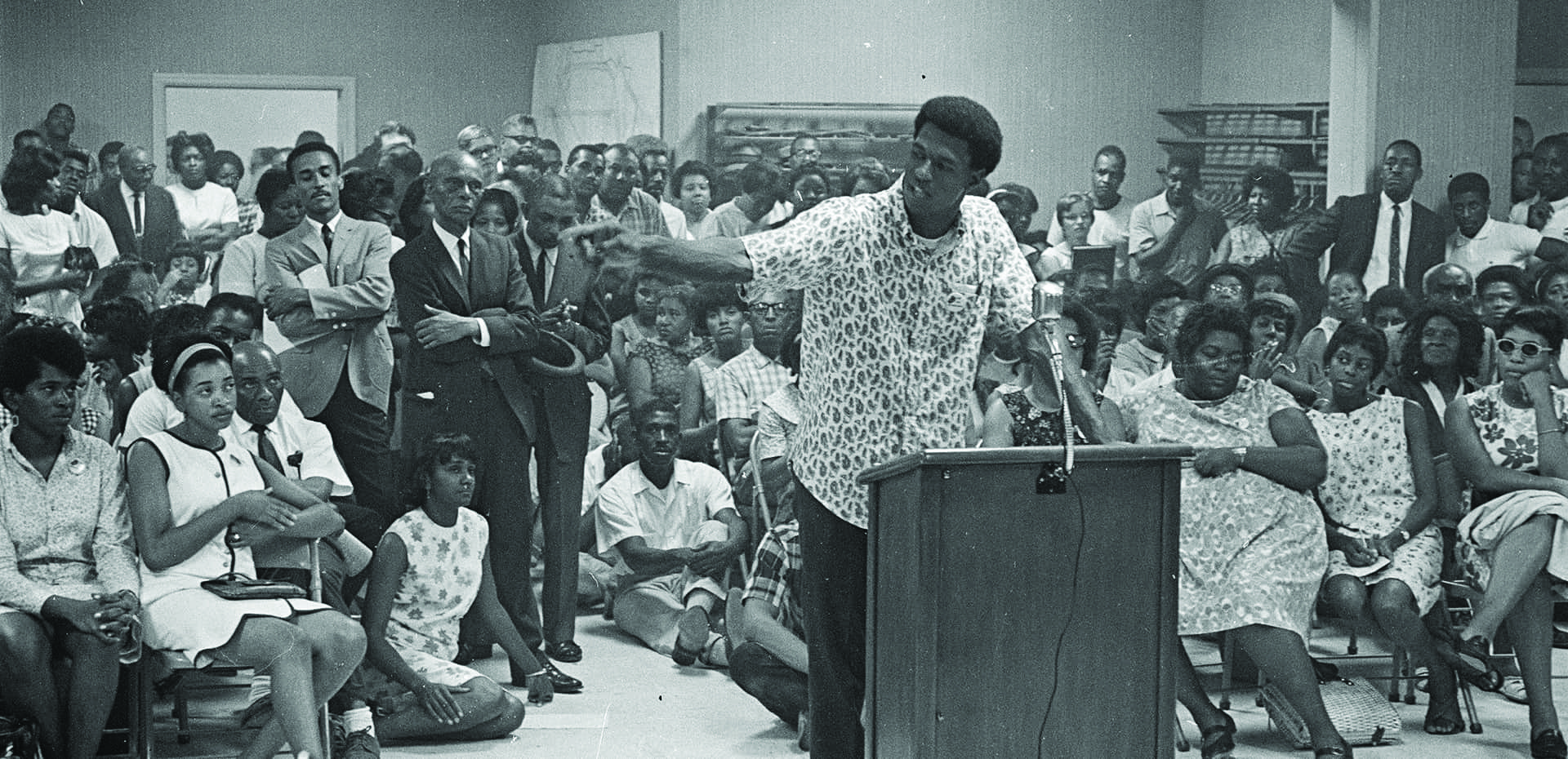 In 1967, the City decided to build a new public housing project on Bacon Street in majority-Black southeast Durham. The decision sparked an outcry and residents demanded that the City also construct public housing in white areas of town. The City soon canceled the Bacon Street project. Community organizer Howard Fuller is pictured here speaking at a City Council meeting packed with many other committed advocates. Courtesy Durham Herald Co. Newspaper, North Carolina Collection, Louis Round Wilson Special Collections Library, University of North Carolina at Chapel Hill