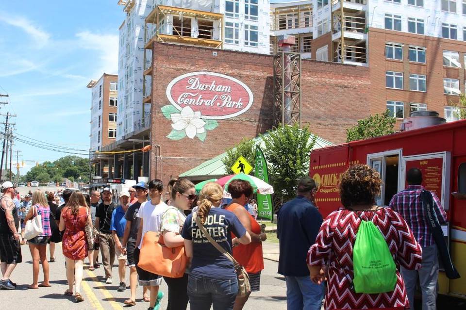 Headline photo of newspaper article titled: Thousands descended on Durham Central Park Sunday for a special Father's Day Food Truck Rodeo, Courtesy Herald Sun, Jun 17, 2012.