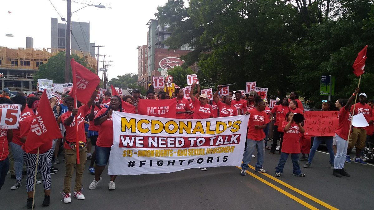McDonald’s workers march in downtown Durham in 2019 to protest low wages and sexual harassment of workers. By walking off the job and flooding city streets, the workers make themselves visible to the many residents that rely on their labor but don’t often stop to think about the injustice of their wages or working conditions.