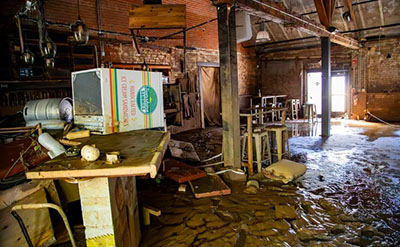 Remnants of Tropical Storm Helene's destruction can be seen inside the Wedge brewery in the Asheville's River Arts District. Photo by Josh Bell