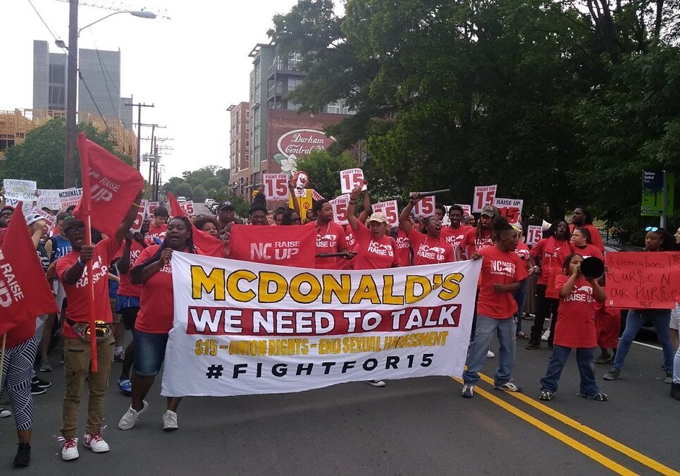 McDonald’s workers march in downtown Durham in 2019 to protest low wages and sexual harassment of workers. By walking off the job and flooding city streets, the workers make themselves visible to the many residents that rely on their labor but don’t often stop to think about the injustice of their wages or working conditions.